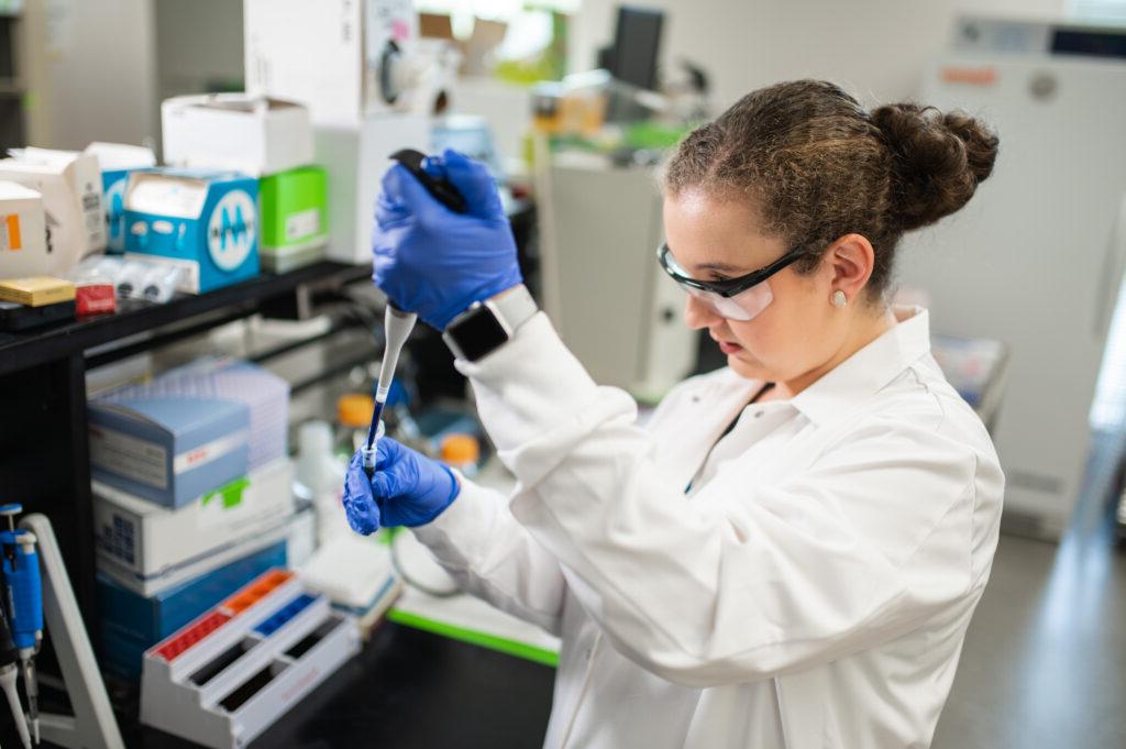 a student in a labcoat